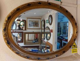 A gilt framed bevelled oblong wall mirror