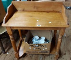 A 73cm Victorian pine washstand with spalshback, ring turned supports and undertier