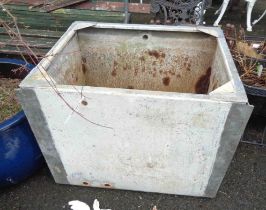 A large vintage metal transit crate