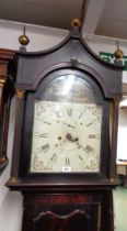 A 19th Century mahogany longcase clock, the 31cm painted arched dial with subsidiary seconds dial,