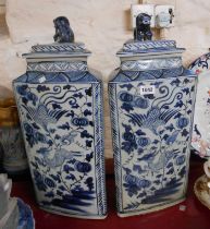 A pair of large modern Chinese porcelain lidded vases of triangular form with blue painted