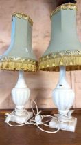 A pair of vintage alabaster table lamps of urn form - each sold with a tasseled shade