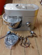 A modern Kenwood Titanium food mixer with accessories