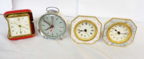 A vintage Diamond Brand alarm clock and three others