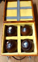 A set of four Hillier wooden bowls set in later fitted wooden case