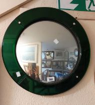 A 46.5cm diameter Art Deco convex wall mirror with wide bevelled green glass border