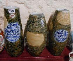 Three mid 20th Century Chinese porcelain vases each with hand painted and brickwork panels on a