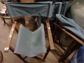 A pair of vintage director's style folding chairs with slung upholstery