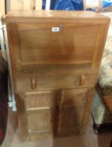 A 60cm vintage quarter sawn oak bureau with pigeon-hole fitted interior and double panelled cupboard