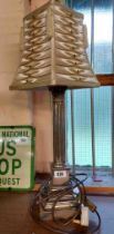 A modern silver plated lamp of Corinthian column form with stepped pedestal base - sold with a