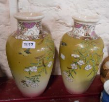 A pair of late 19th Century Japanese Satsuma vases with applied decoration, depicting birds amidst