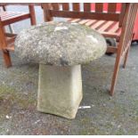 A concrete two-part mushroom garden ornament