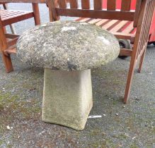 A concrete two-part mushroom garden ornament