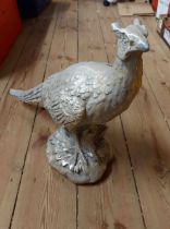 A large resin model, depicting a pheasant with silver painted finish