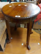 A 40cm diameter Edwardian stained walnut tea table with gadrooned edge