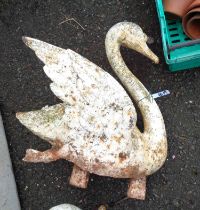 An old white painted cast iron ornament in the form of a swan