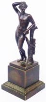 A bronze figurine, depicting a classical figure set on plinth base