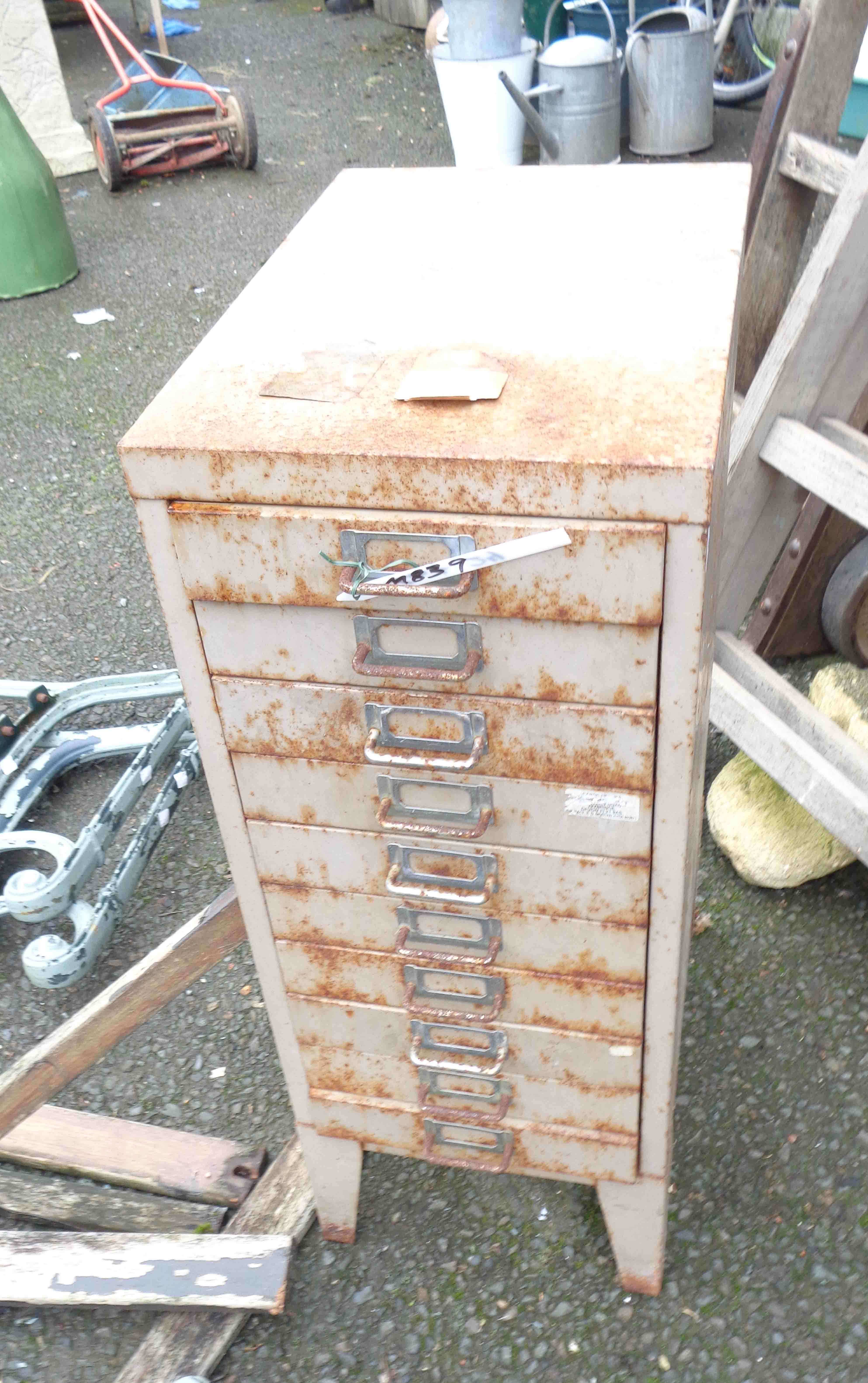 A vintage metal ten drawer narrow filing chest