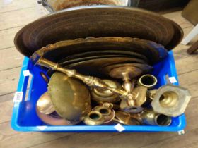 A crate containing a large quantity of brass and copper items including copper kettle, candlesticks,