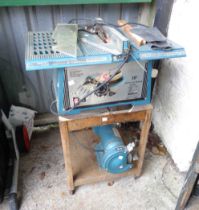 A Naerok NTS-10 table saw, bench mounted with bench grinder to undertier