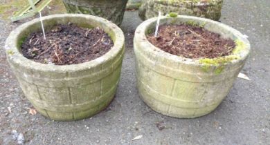 A pair of 36cm diameter concrete planters of barrel form