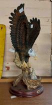 A large resin figurine, depicting an eagle