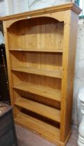 A 1.2m modern pine five shelf open bookcase