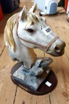 A large resin figurine, depicting a horse's head