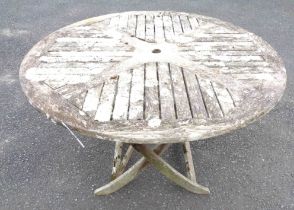 A 1.1m diameter teak folding garden table