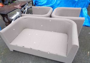 A modern woven plastic three piece conservatory suite