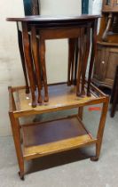 A vintage oak two tier tea trolley - sold with a nest of three tea tables