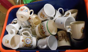A crate containing a quantity of commemorative and other mugs including Bunnykins, etc.