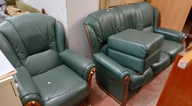A Euroclass three piece suite and matching footstool, upholstered in green leather with applied