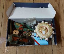 A box containing a quantity of assorted collectable items including carved and painted wooden frog