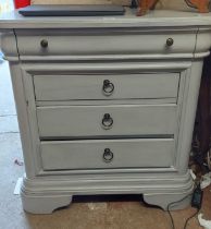 A 76cm modern blue painted bedroom chest of one long and three short drawers, set on bracket feet