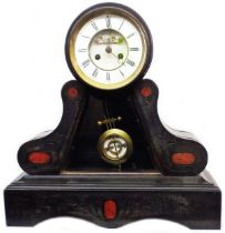 A late Victorian black slate and red marble cased ornate drum and bracket base mantel clock with