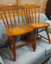 A set of six modern pine Windsor style stick back standard chairs