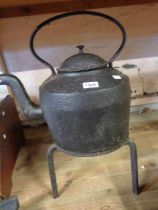 A large cast iron kettle marked to the base J&J Siddons with an associated lid - sold with a wrought