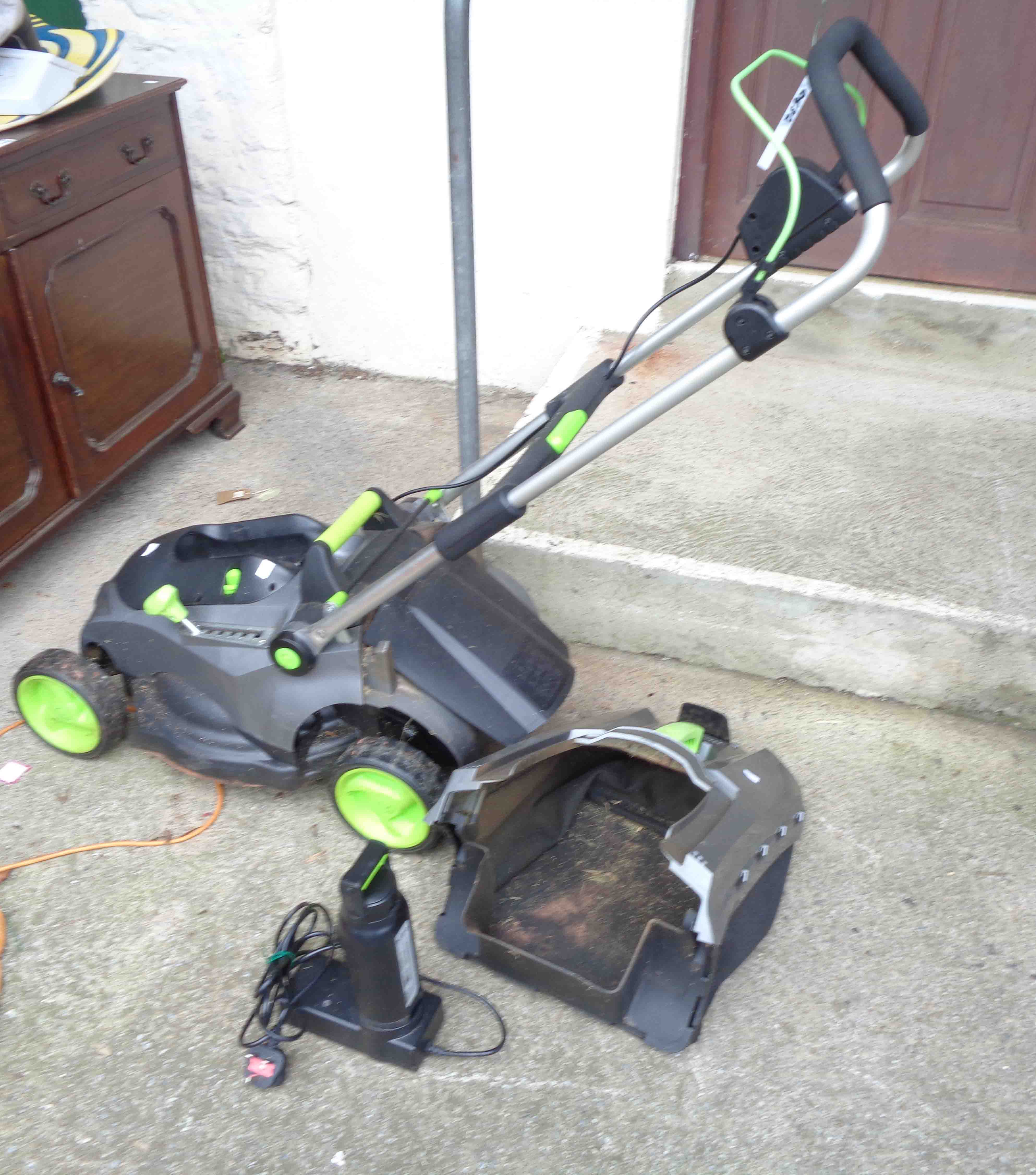 A GTech CLM0001 36V cordless lawn mower, with battery, charger and grass box