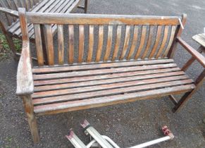 A 1.5m Alexander Rose Ltd teak garden bench with slatted back and seat