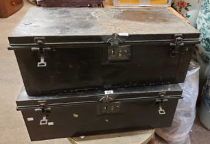 A pair of 78cm vintage black japanned metal colonial transit trunks - Andy Andrews missionary in