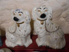 A pair of 20th Century Staffordshire comforter spaniels