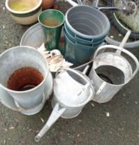 Two galvanised watering cans - sold with a small galvanised bath, a quantity of buckets, etc.