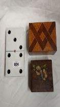 An Italian pokerwork and painted box containing a quantity of dice and another box - sold with a