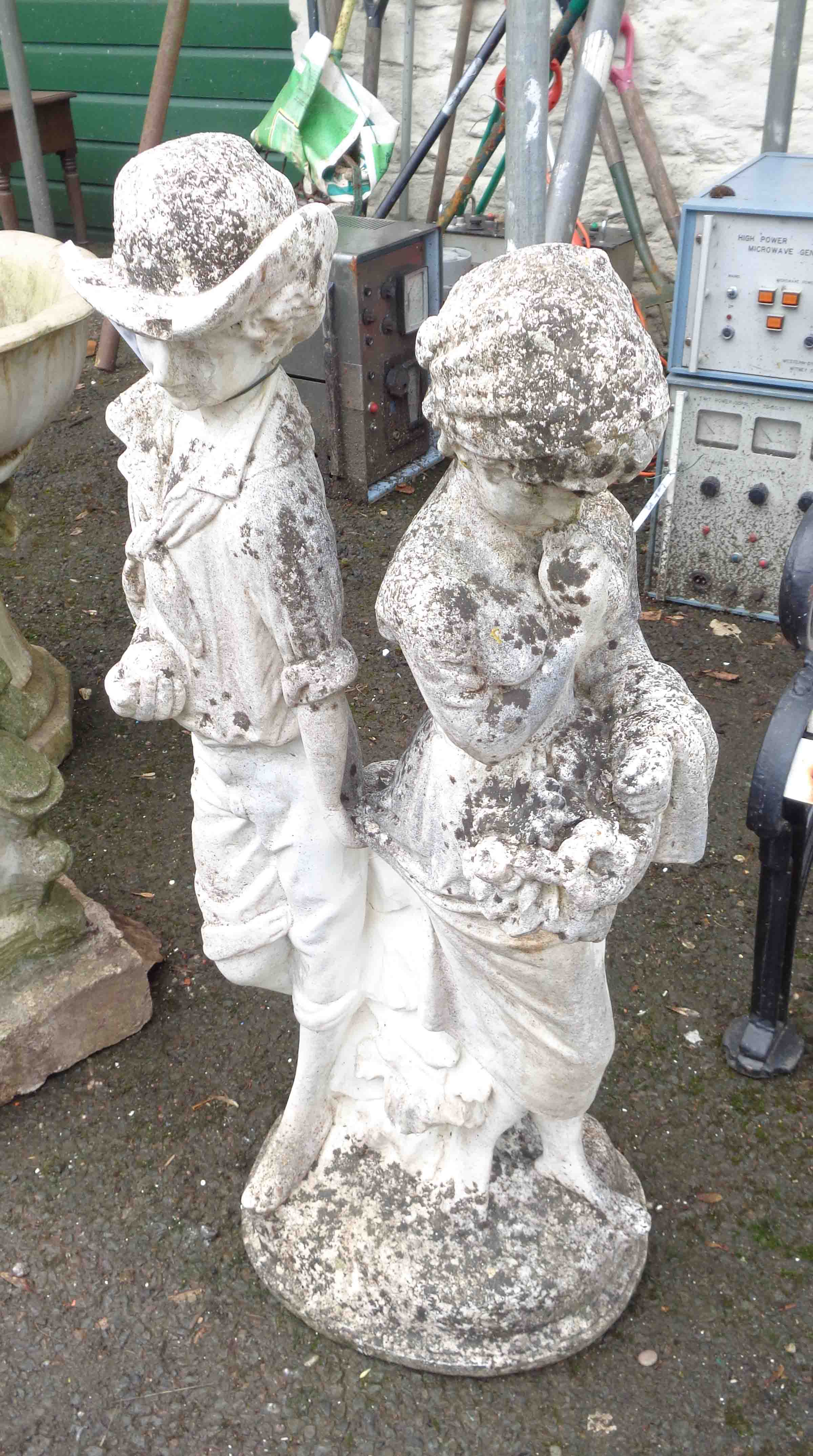 A 90cm high concrete statue, depicting a boy and a girl