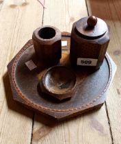 A vintage French wooden smoker's companion set with carved and pokerwork decoration