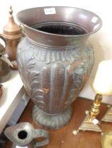 A large Italian copper vase with embossed decoration