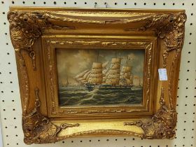 An ornate gilt framed reproduction maritime painting