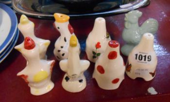 Eight ceramic pie funnels of various form including chicken, duck, etc.