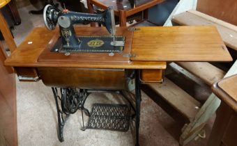 A 90cm vintage Singer sewing machine, set on a cast iron treadle base